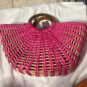 Pink wicker purse with wooden handle